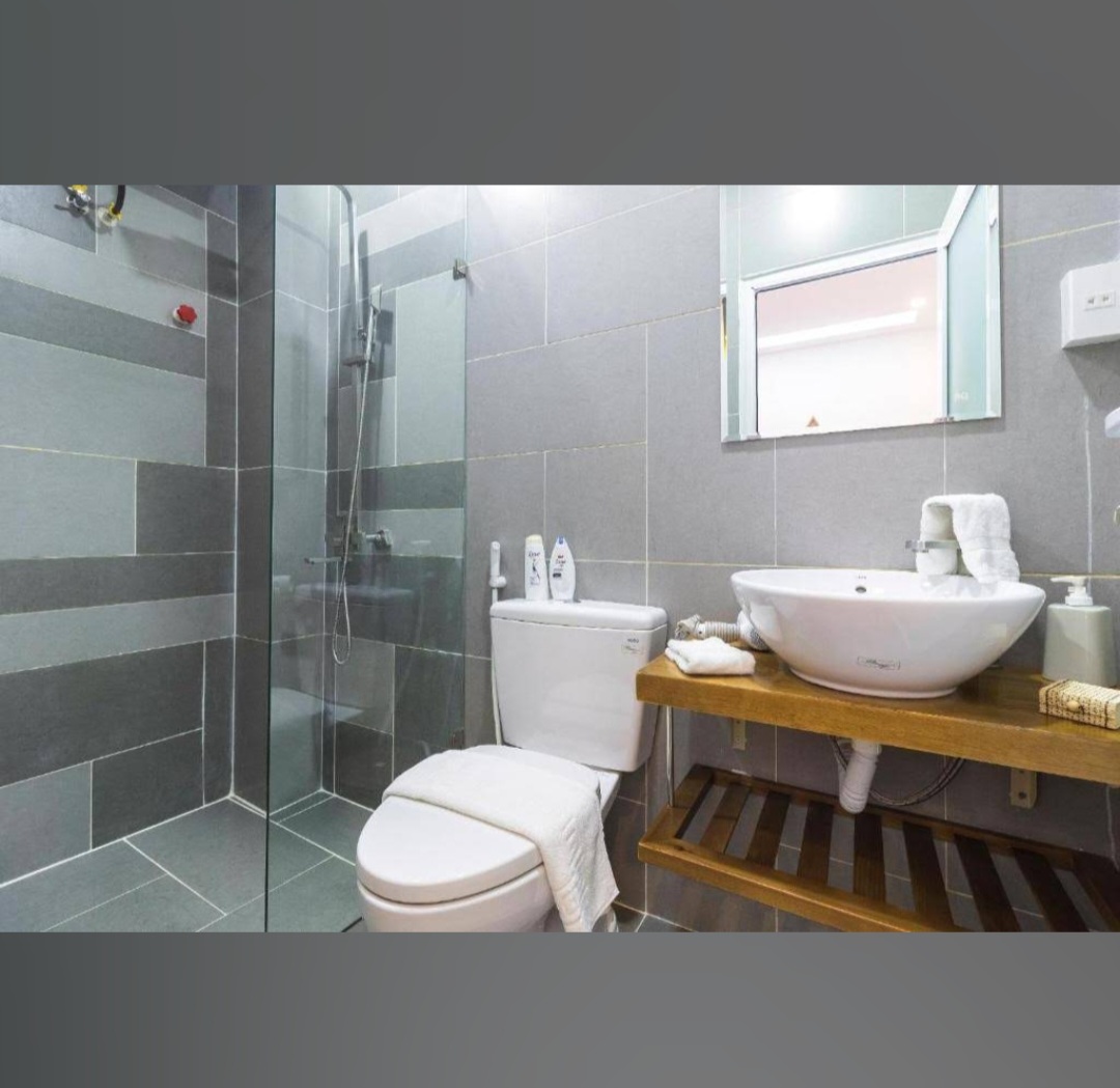 Modern bathroom with glass shower and vessel sink