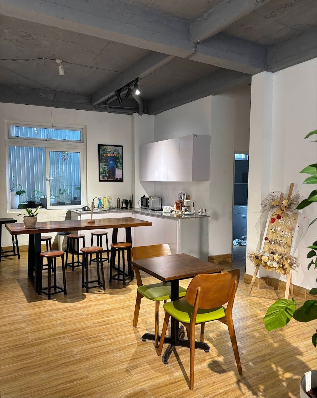 The Green House Da Lat — cozy kitchen and dining area with natural materials