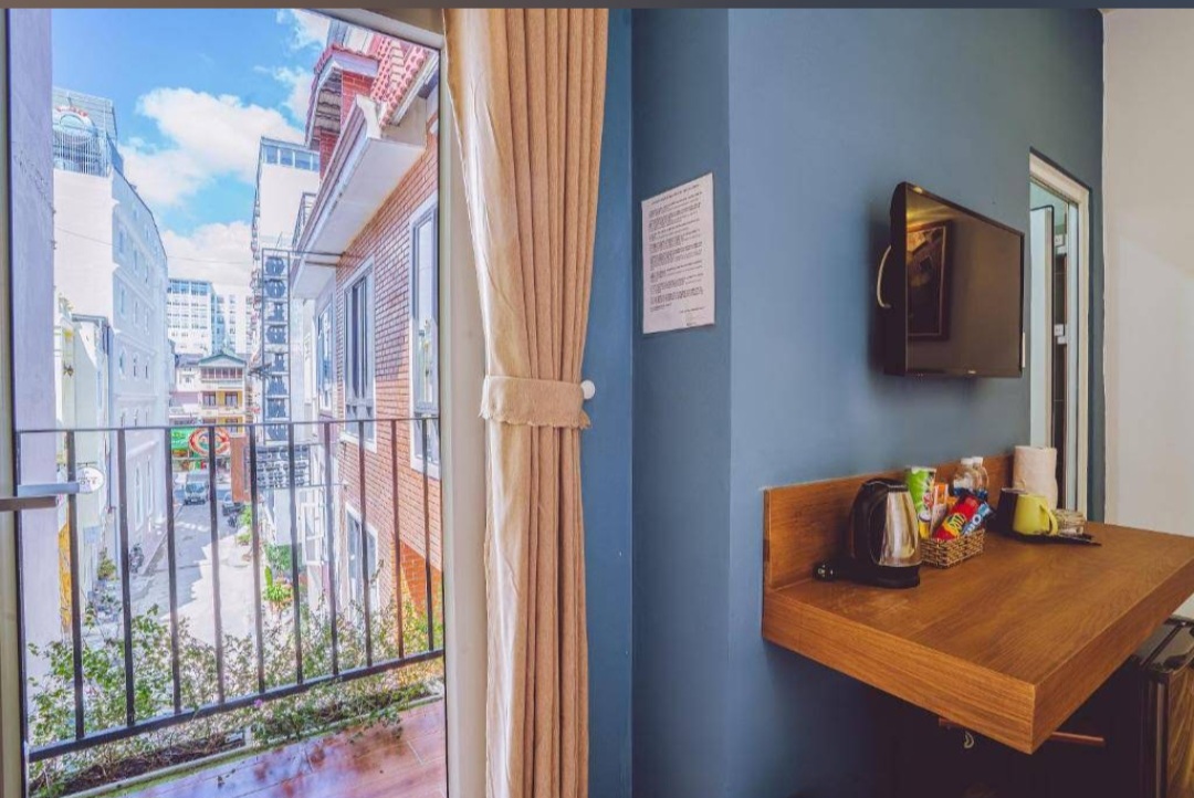 Room detail — balcony view and in-room entertainment