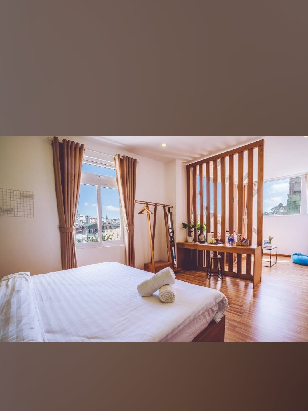 Deluxe Wood Room — warm tones with wooden partition